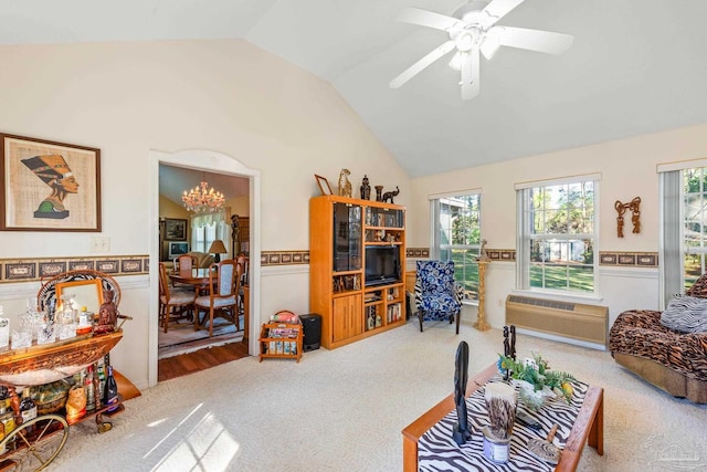 living room featuring carpet floors, an AC wall unit, ceiling fan, and vaulted ceiling