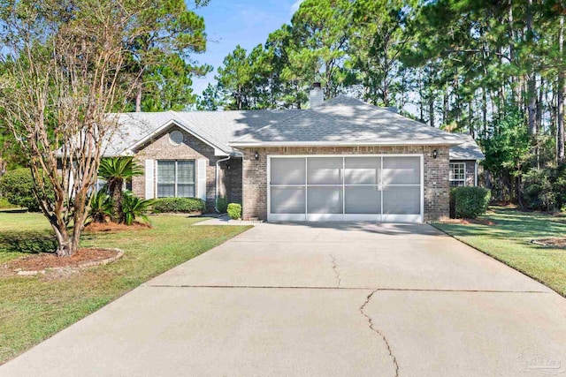 ranch-style home featuring a garage and a front lawn