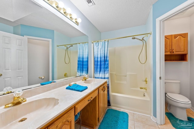 full bathroom featuring toilet, vanity, tile patterned flooring, shower / bath combination with curtain, and a textured ceiling