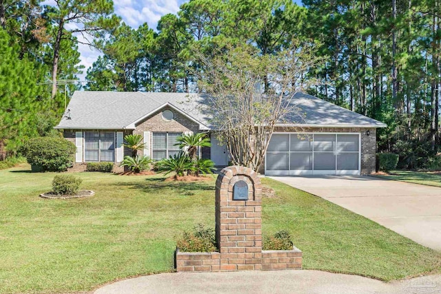 single story home with a garage and a front yard