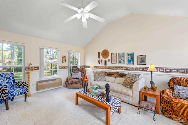 living room with ceiling fan, lofted ceiling, plenty of natural light, and an AC wall unit