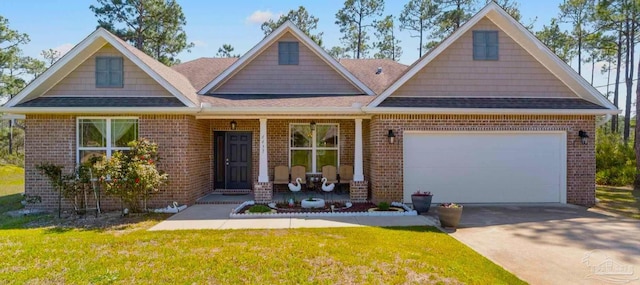 view of front of house with a porch, driveway, brick siding, and roof with shingles