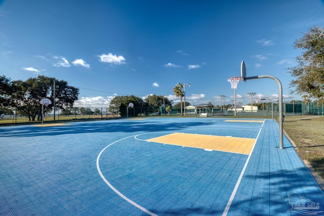view of sport court featuring community basketball court and fence