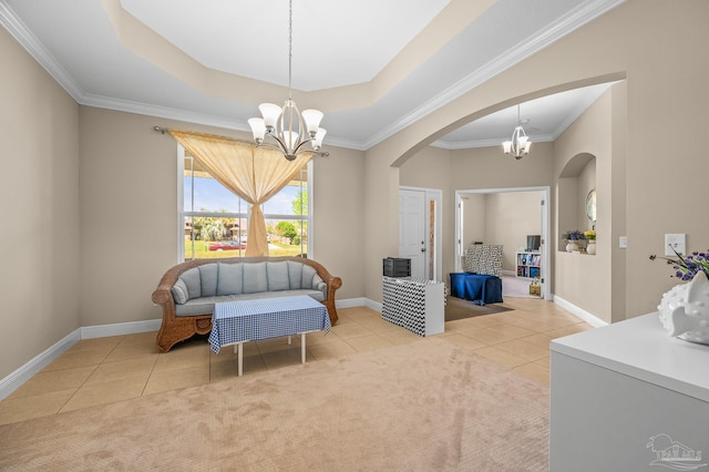 sitting room featuring a chandelier, arched walkways, tile patterned flooring, baseboards, and crown molding