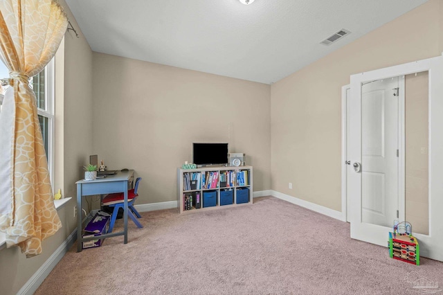 game room with carpet and baseboards