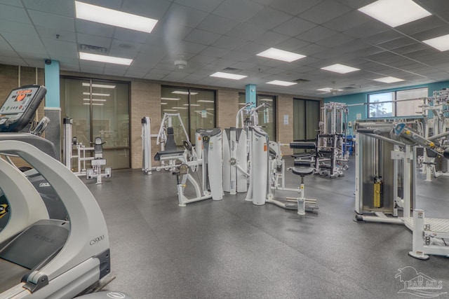 workout area featuring a drop ceiling