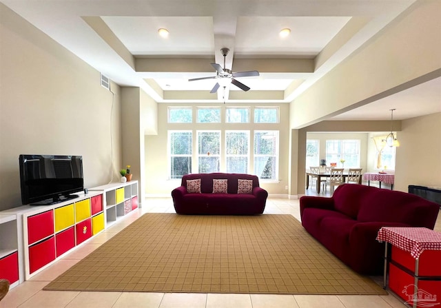 living area with a ceiling fan, coffered ceiling, light tile patterned flooring, beamed ceiling, and recessed lighting