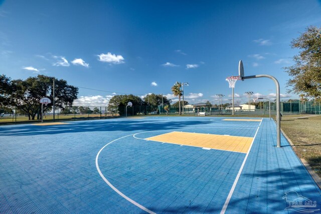 view of sport court featuring community basketball court and fence