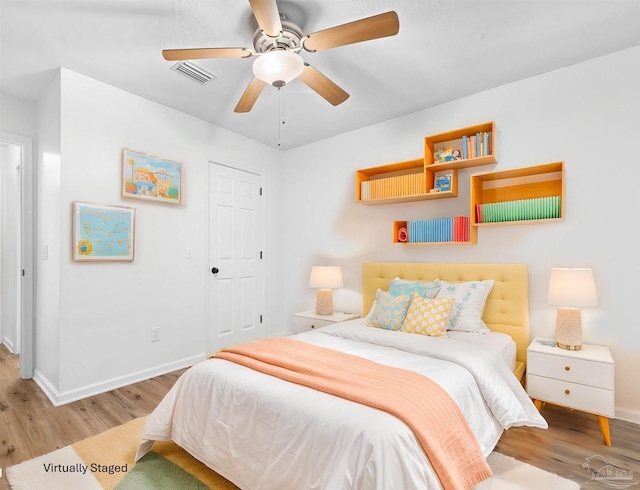 bedroom featuring ceiling fan and light hardwood / wood-style floors