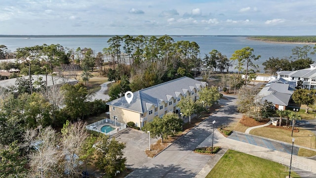 birds eye view of property featuring a water view