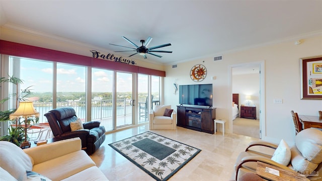 living room with ornamental molding and ceiling fan