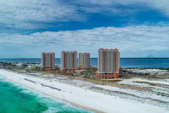 drone / aerial view featuring a view of the beach and a water view