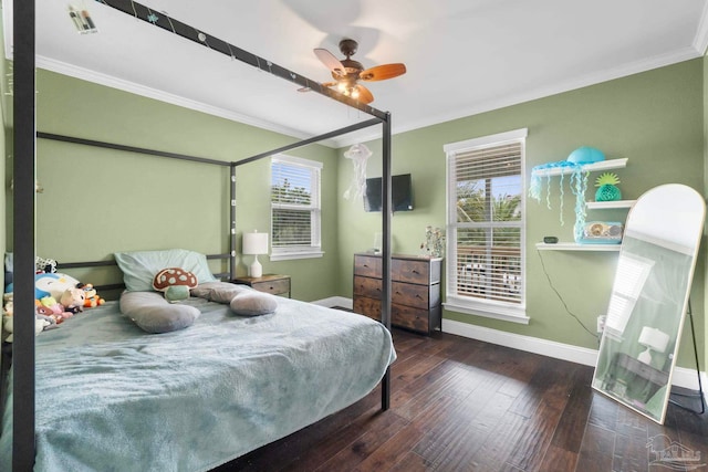 bedroom featuring dark wood-type flooring, ornamental molding, multiple windows, and ceiling fan