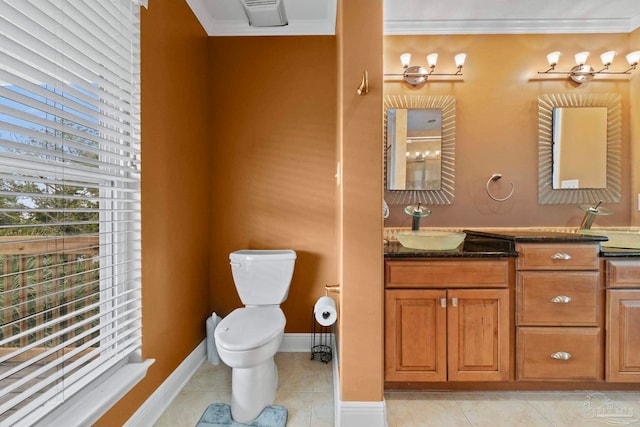 bathroom with crown molding, vanity, tile patterned flooring, and toilet