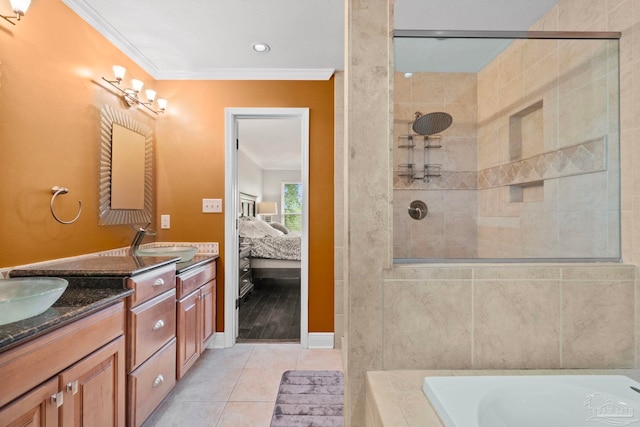 bathroom featuring vanity, shower with separate bathtub, ornamental molding, and tile patterned floors