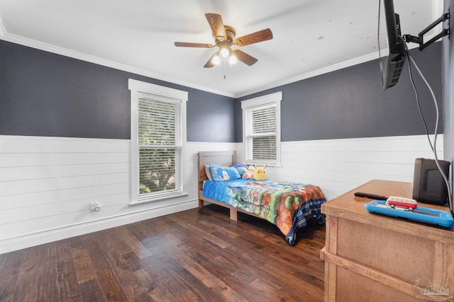 bedroom with dark wood-type flooring, ornamental molding, and ceiling fan