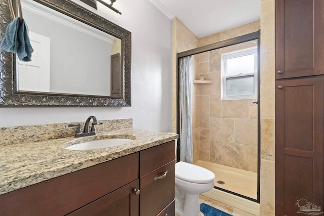 bathroom with crown molding, vanity, walk in shower, and toilet