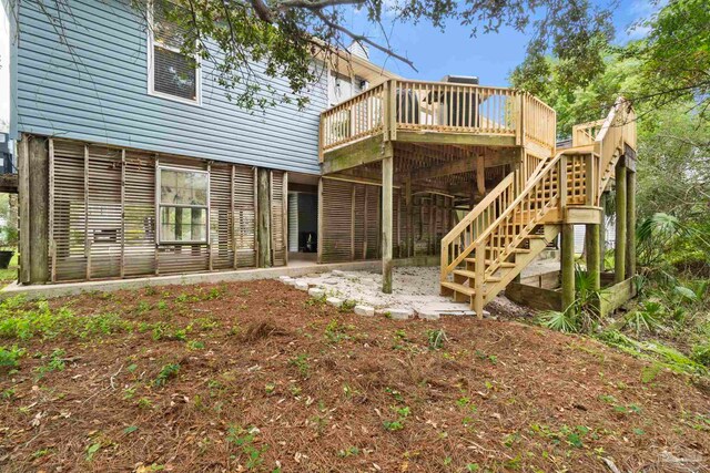 412 Deer Point Dr, Gulf Breeze, FL 32561 - back of property with stairs and a deck