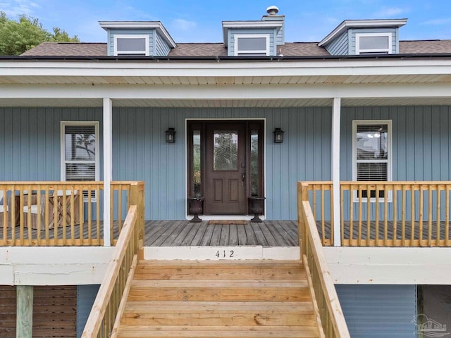 412 Deer Point Dr, Gulf Breeze, FL 32561 - entrance to property with a porch, a chimney, and a shingled roof