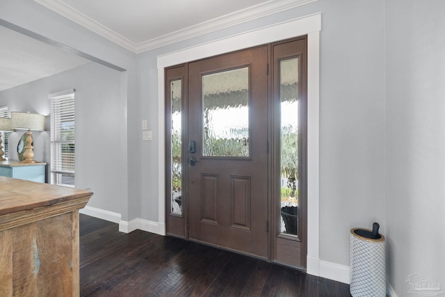 foyer entrance with dark hardwood / wood-style floors and ornamental molding