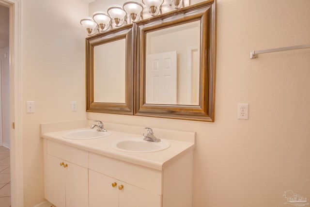 full bath with double vanity and a sink