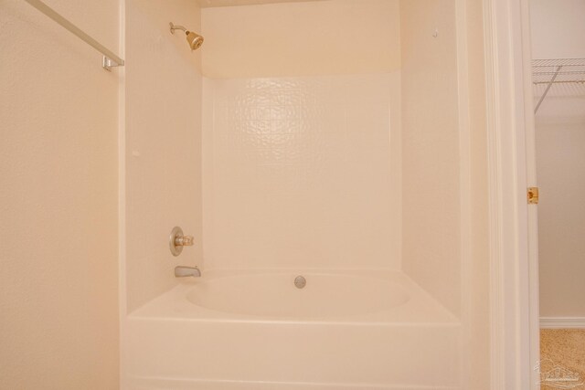 bathroom featuring washtub / shower combination