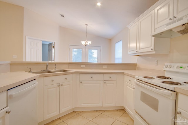 kitchen with white appliances, light countertops, and under cabinet range hood