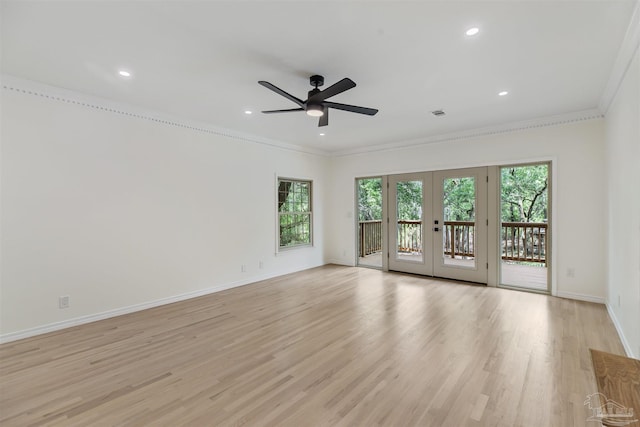 unfurnished room with ornamental molding, ceiling fan, light hardwood / wood-style floors, and french doors