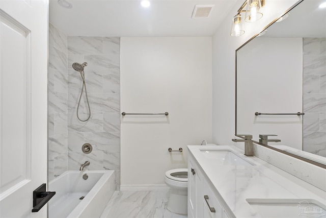 full bathroom with vanity, tiled shower / bath combo, and toilet