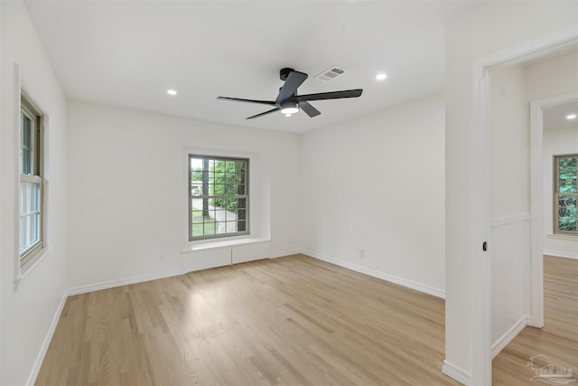 unfurnished room featuring ceiling fan and light wood-type flooring