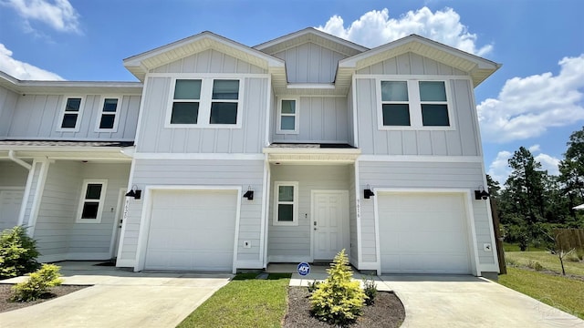 9447 Nature Creek Ln, Pensacola, FL 32526 - view of front facade featuring board and batten siding, concrete driveway, and an attached garage