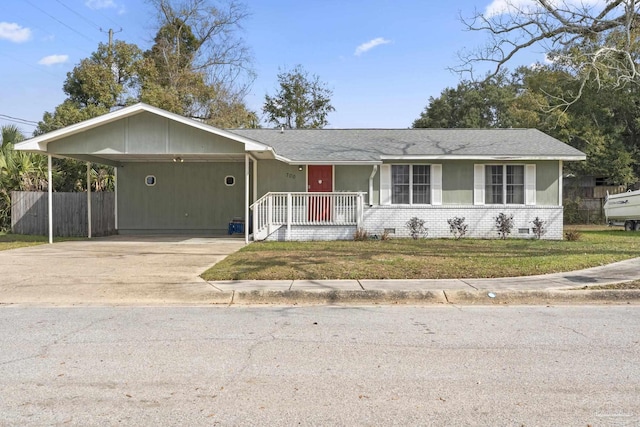 ranch-style home with a front yard and a carport