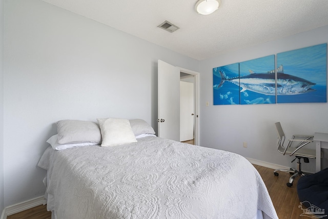 bedroom featuring wood-type flooring