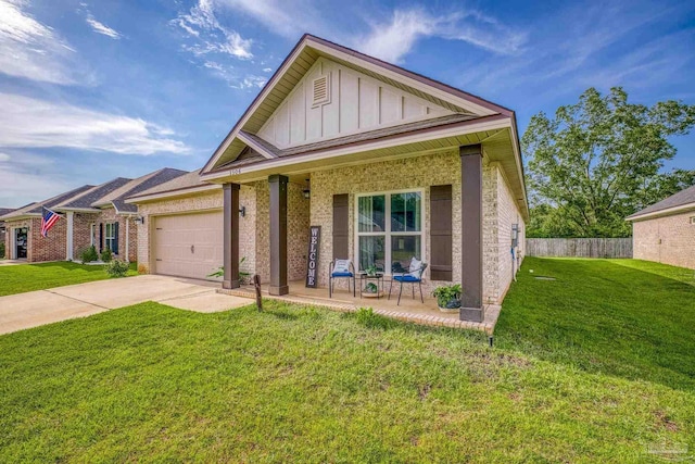 view of front of property featuring a garage, driveway, board and batten siding, and a front lawn