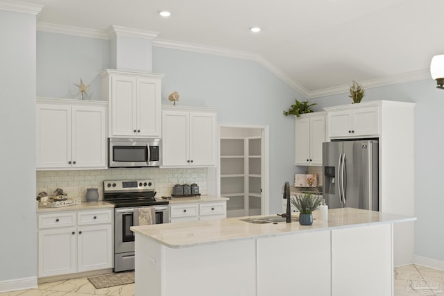 kitchen with tasteful backsplash, marble finish floor, a sink, and stainless steel appliances