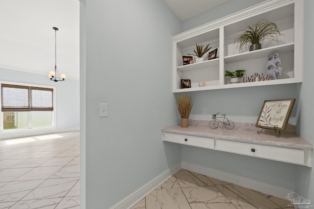 interior details featuring baseboards and an inviting chandelier