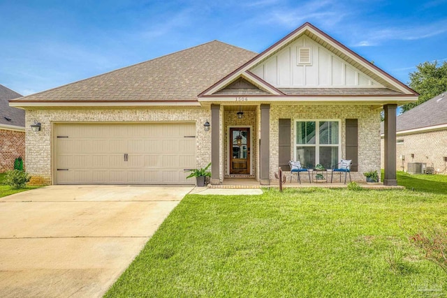 view of front of property with driveway, board and batten siding, a front lawn, a garage, and a shingled roof
