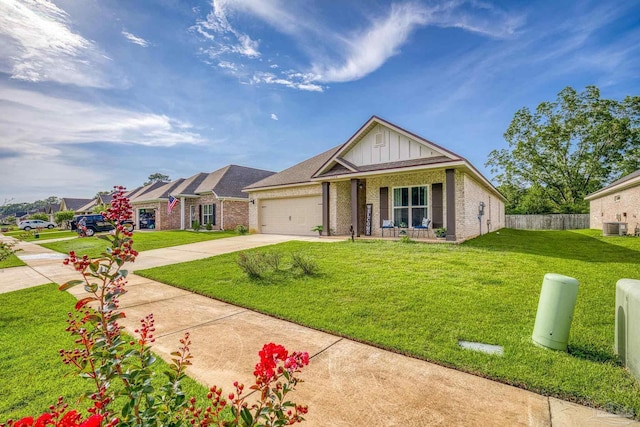 view of front of house with a front yard, central AC unit, board and batten siding, concrete driveway, and brick siding