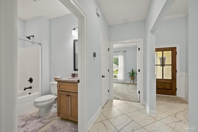 full bath featuring baseboards, toilet, tub / shower combination, vanity, and marble finish floor