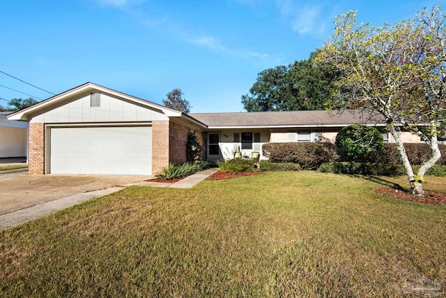 ranch-style house featuring a garage and a front lawn