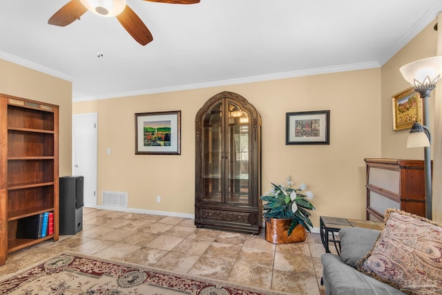 sitting room with ornamental molding and ceiling fan