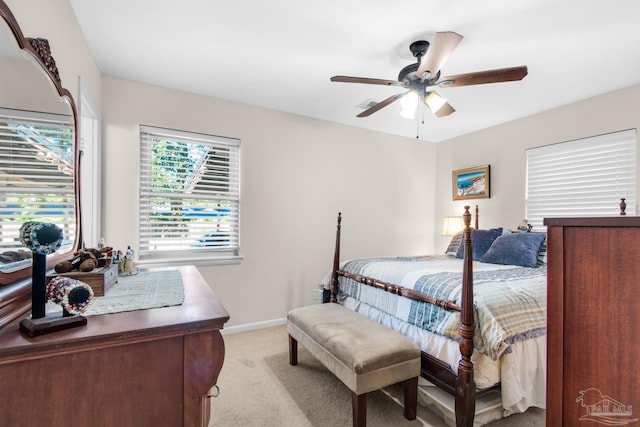 bedroom featuring light carpet and ceiling fan