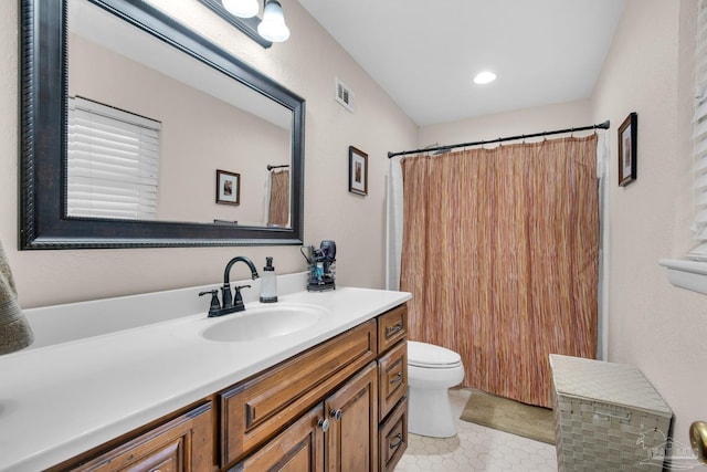 bathroom featuring vanity, a shower with curtain, tile patterned floors, and toilet