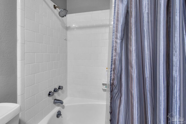 bathroom featuring shower / bath combination with curtain