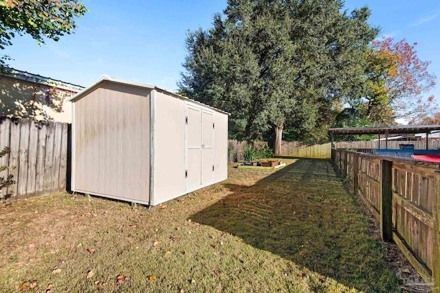 view of outbuilding with a lawn