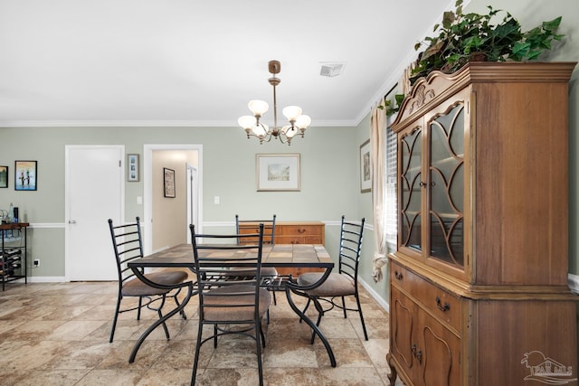 dining room featuring crown molding and an inviting chandelier