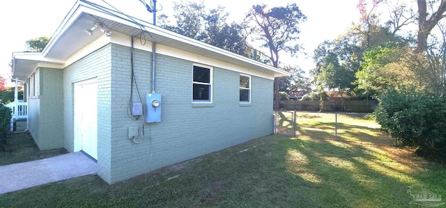 view of property exterior with a lawn