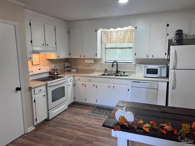 kitchen featuring a textured ceiling, sink, white cabinets, and white appliances