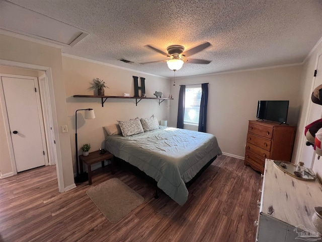 bedroom with a textured ceiling, dark hardwood / wood-style flooring, ceiling fan, and ornamental molding