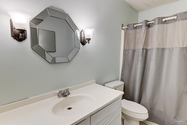 bathroom with toilet, a shower with shower curtain, and vanity